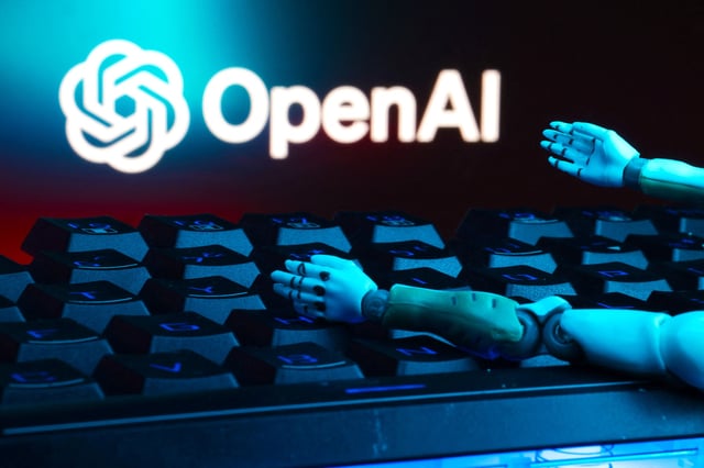 The OpenAI logo, a keyboard, and robot hands are seen in this illustration taken January 27, 2025. REUTERS/Dado Ruvic/Illustration/File Photo