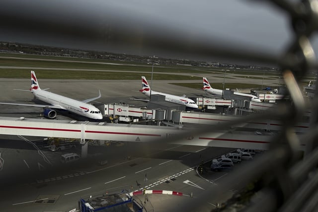 FILE - Planes are parked at Terminal 5 at Heathrow Airport in London, Friday, March 21, 2025.(AP Photo/Kin Cheung, file)