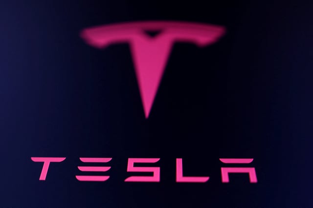 Tesla logo is seen in this illustration taken July 23, 2025. REUTERS/Dado Ruvic/Illustration/ File Photo
