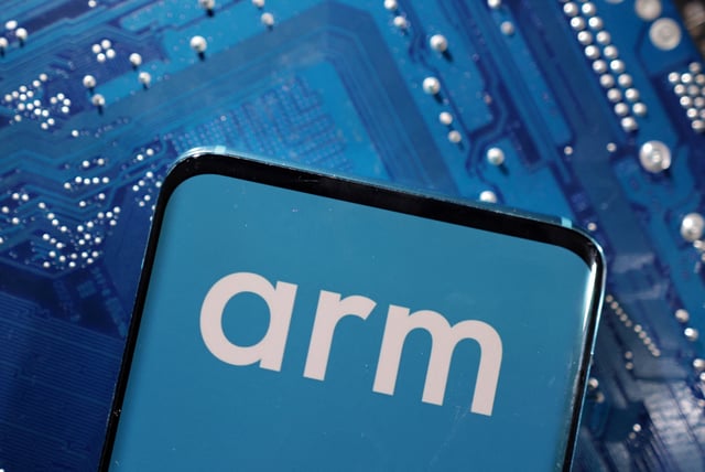 A smartphone with a displayed Arm Ltd logo is placed on a computer motherboard in this illustration taken March 6, 2023. REUTERS/Dado Ruvic/Illustration/ File Photo