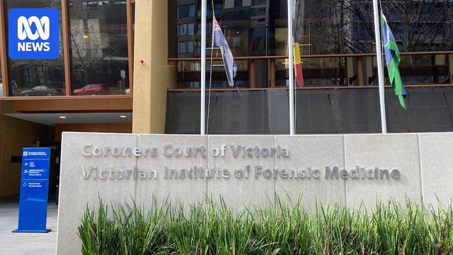 The Coroners Court of Victoria sign in front of the Australian, Aboriginal, and Torres Strait Islander flags.