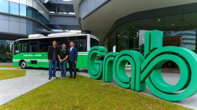 Yee Wee Tang, Group Managing Director of Operations at Grab (left), Philip Ang, GrabTaxi driver-partner (center), and Ryan (Ho Jin) Kim, Managing Director, Business and International for A2Z at the launch of Grab&#39;s AV shuttle in Singapore on July 8, 2025.