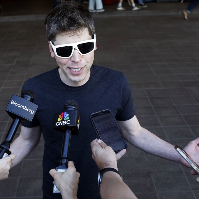 SUN VALLEY, IDAHO - JULY 08: CEO of OpenAI Sam Altman speaks to members of the media as he arrives at the Sun Valley lodge for the Allen & Company Sun Valley Conference on July 8, 2025 in Sun Valley, Idaho. Every year, some of the world's wealthiest and most powerful figures from the media, finance, technology, and political spheres converge at the Sun Valley Resort for the exclusive week-long conference hosted by boutique investment bank Allen & Co.