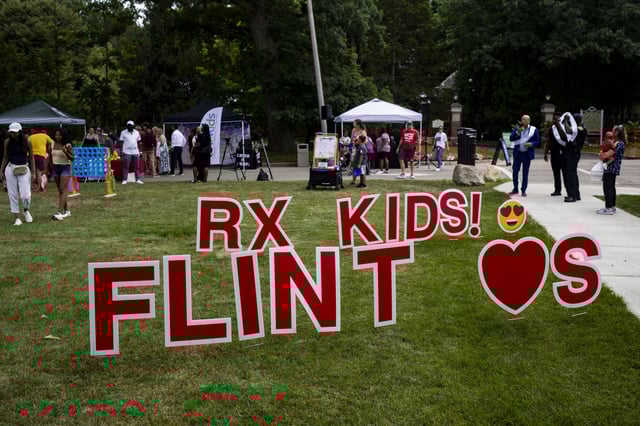 Families and community members arrive for the Flint Rx Kids Baby Parade event on July 25, 2025 on the Applewood Campus in Flint, Michigan. The event celebrates the continued impact of Rx Kids on Flint families and babies. (AP Photo/Emily Elconin)