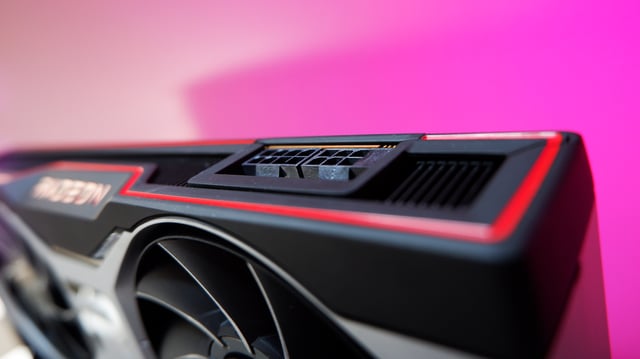 An AMD Radeon RX 6700 XT graphics card with a colourful gradient background
