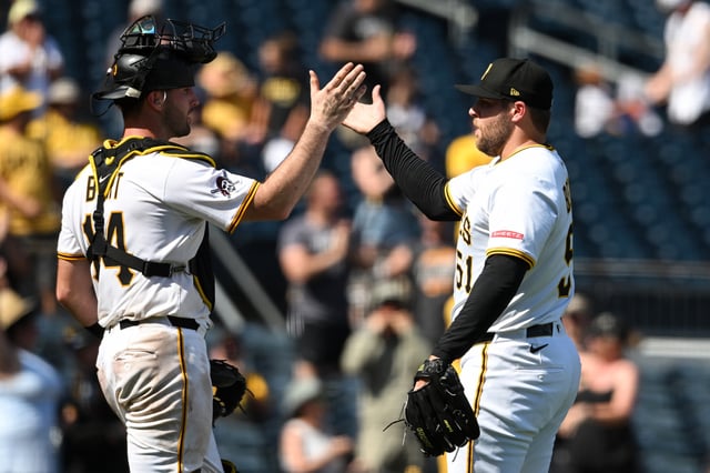 PITTSBURGH, PENNSYLVANIA - JUNE 22: Joey Bart #14 and David Bednar #51 of the Pittsburgh Pirates celebrate the team&#39;s 8-3 win over the Texas Rangers at PNC Park on June 22, 2025 in Pittsburgh, Pennsylvania.