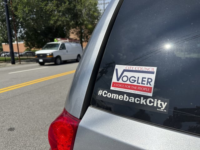 A bumper sticker outside the offices of Showcase Magazine in Danville, Va., where city Councilmember Lee Vogler was attacked and set on fire, is seen on Wednesday, July 30, 2025.