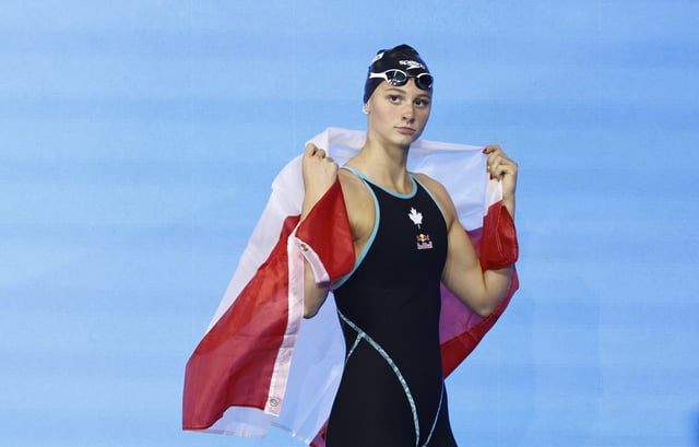Swimming - World Aquatics Championships - Women 200m Butterfly Finals - World Aquatics Championships Arena, Singapore - July 31, 2025 Canada's Summer McIntosh after winning the final REUTERS/Tingshu Wang