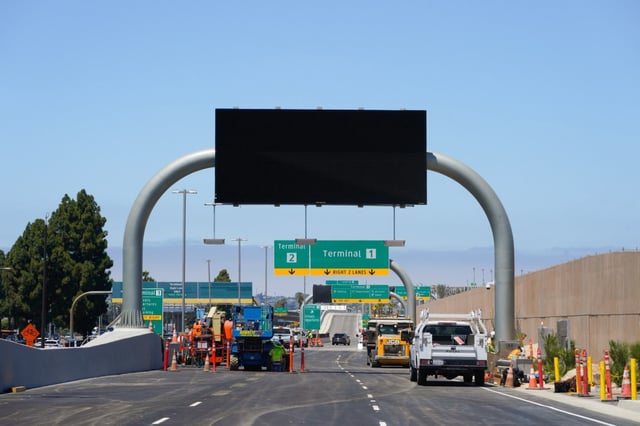 The new airport road is scheduled to open on Friday. Lane 1 (on the left) directs you to Terminal 2, while lanes 2 and 3 lead to Terminal 1 at San Diego International Airport. The large electronic signs will display the airlines along with the terminals from which they are operating out of.  (Nelvin C. Cepeda / The San Diego Union-Tribune)