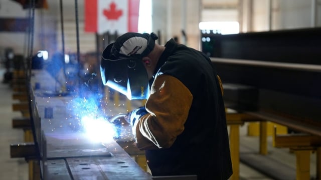 A worker welds at a steel manufacturing facility, in Hamilton on July 16, one of the industries hit by U.S. tariffs.