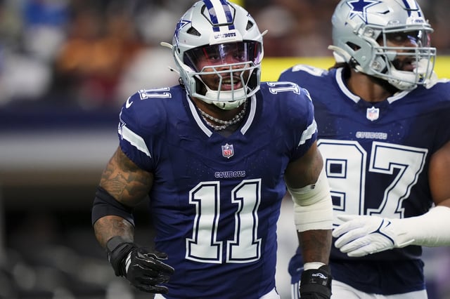Micah Parsons #11 of the Dallas Cowboys celebrates after a play against the Washington Commanders during an NFL football game at AT&amp;T Stadium on January 5, 2025 in Arlington, Texas.
