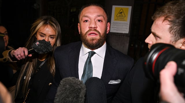 Conor McGregor leaves court in 2024.
