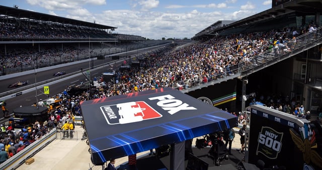 May 23, 2025; Indianapolis, IN, USA; General view of an IndyCar on Fox logo with fans in the main grandstands during final practice on Carb Day for the Indianapolis 500 at Indianapolis Motor Speedway. Mandatory Credit: Mark J. Rebilas-Imagn Images