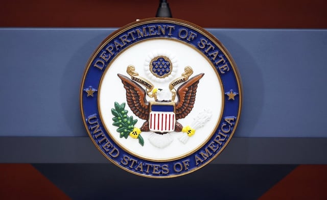 FILE - The seal of the State Department is seen at the Washington Passport Agency, July 12, 2016, in Washington. 