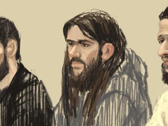 FILE - In this courtroom sketch, defendants from left, Mohamed Abrini, Osama Krayem, Salah Abdeslam and Sofiane Ayari look out from a specially designed glass box during the trial for the Brussels attacks, that took place on March 22, 2016, at the Justitia building in Brussels, Dec. 5, 2022. (Petra Urban via AP, File)
