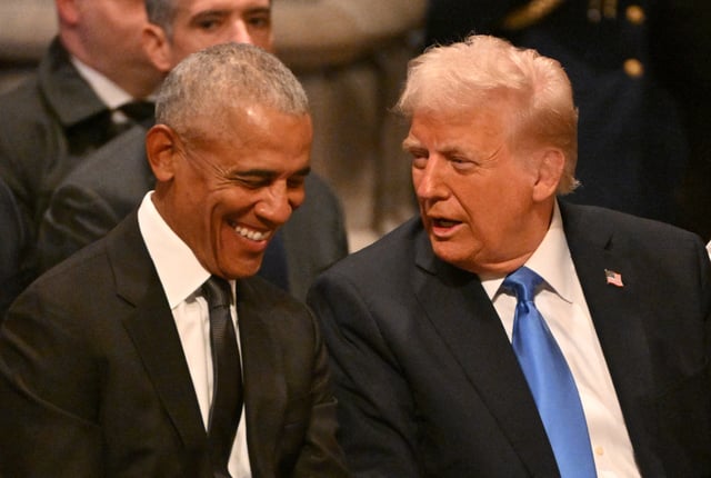 Former US President Barack Obama speaks with President-elect Donald Trump before the State Funeral Service for former US President Jimmy Carter at the Washington National Cathedral in Washington, DC, on January 9, 2025.