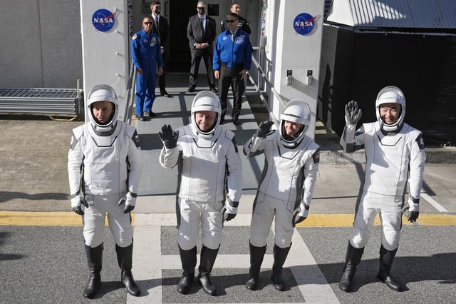 Astronauts, from left, Oleg Platonov, of Russia, Mike Fincke, of NASA, Zena Cardman, of NASA, and Kimiya Yui, of Japan wave to photographers as they leave the Operations and Checkout Building for a trip the Kennedy Space Center&#39;s Launch Pad 39-A and a planned liftoff on a SpaceX Falcon 9 rocket Thursday, July 31, 2025, in Cape Canaveral , Fla.