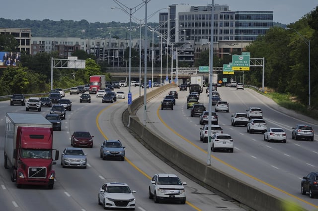 Vehicles drive along a highway Wednesday, July 30, 2025, in Cincinnati. (AP Photo/Joshua A. Bickel)