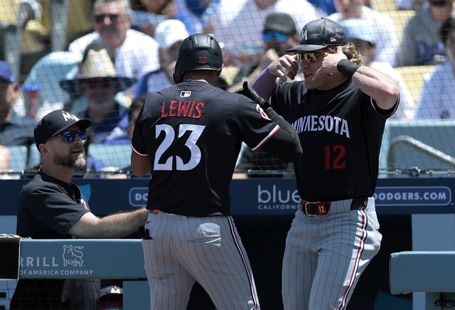 Royce Lewis #23 of the Minnesota Twins celebrates a home run with Harrison Bader #12 against the Los Angeles Dodgers in the first inning at Dodger Stadium on July 23, 2025 in Los Angeles.