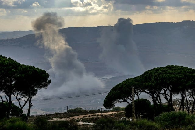 Smoke rises over the al-Khardali area of south Lebanon following an Israeli air strike.