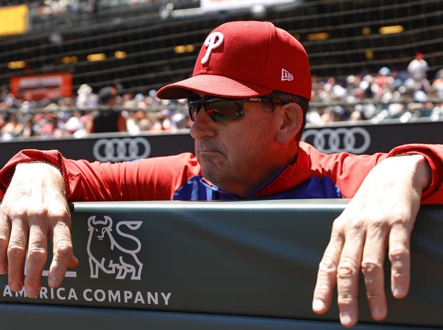 SAN FRANCISCO, CA - JULY 9: Manager Rob Thomson #59 of the Philadelphia Phillies in the dugout before the game against the San Francisco Giants at Oracle Park on July 9, 2025 in San Francisco, California. The Phillies defeated the Giants 13-0. (Photo by Michael Zagaris/Getty Images)