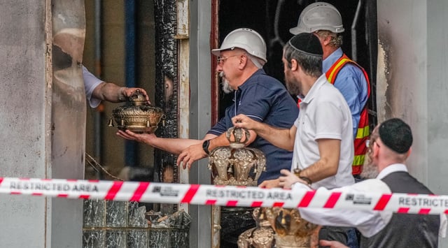 Congregants recover items from the Adass Israel Synagogue on December 06, 2024 in Melbourne, Australia. (Asanka Ratnayake/Getty Images)
