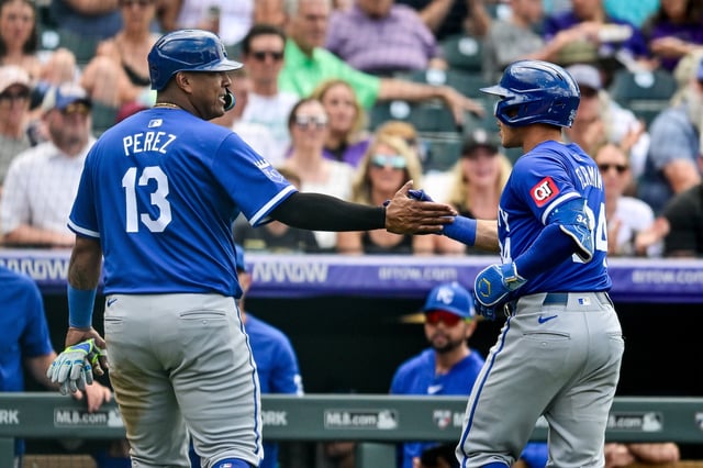 Freddy Fermin #34 and Salvador Perez #13 of the Kansas City Royals celebrate a Perez run on a Fermin sacrifice fly in the eighth inning against the Colorado Rockies at Coors Field on July 7, 2024 in Denver, Colorado.