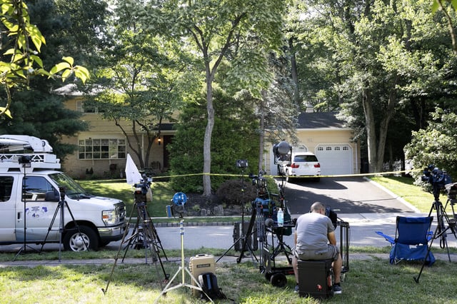 FILE - News media is set up in front of the home of U.S. District Judge Esther Salas, July 20, 2020, in North Brunswick, N.J. (AP Photo/Mark Lennihan, File)
