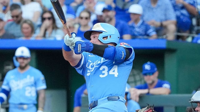 Jul 26, 2025; Kansas City, Missouri, USA; Kansas City Royals catcher Freddy Fermin (34) hits a two run home run against the Cleveland Guardians in the second inning at Kauffman Stadium. Mandatory Credit: Denny Medley-Imagn Images