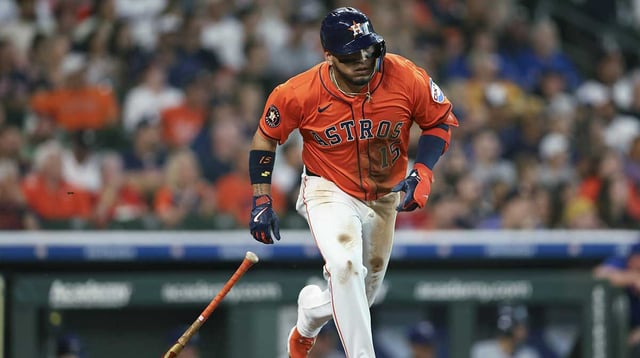 Jul 11, 2025; Houston, Texas, USA; Houston Astros third baseman Isaac Paredes (15) hits a single during the first inning against the Texas Rangers at Daikin Park. Mandatory Credit: Troy Taormina-Imagn Images