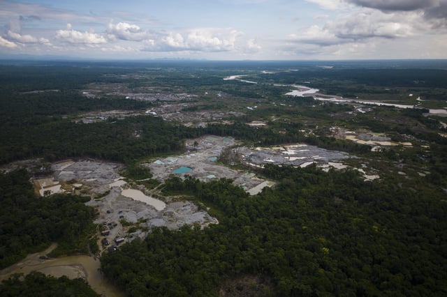 FILE - Visible deforestation from illegal mining surrounds the Quito River, near Paimado, Colombia, Sept. 23, 2024. (AP Photo/Ivan Valencia, File)