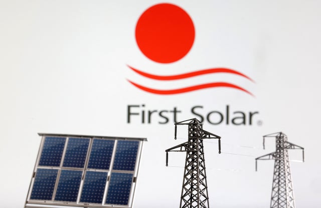 Miniatures of solar panel and electric pole are seen in front of First Solar logo in this illustration taken January 17, 2023. REUTERS/Dado Ruvic/Illustration/File Photo