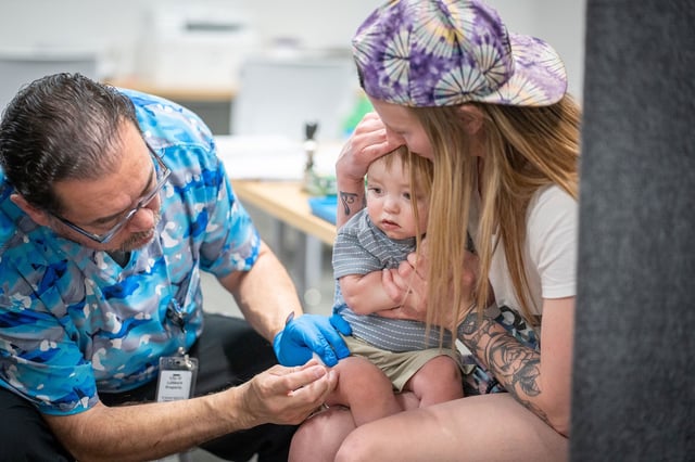 Raynard Covarrubio administers an MMR vaccine at a vaccine clinic in Lubbock, Texas, on March 1.