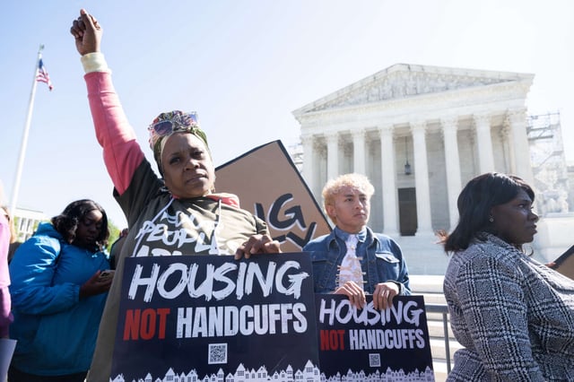 Demonstrators protest outside the U.S. Supreme Court in support of unhoused people as the Court hears the case of City of Grants Pass v. Johnson, in Washington, D.C., on April 22, 2024.