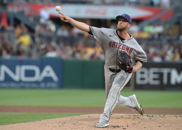 Jul 26, 2025; Pittsburgh, Pennsylvania, USA;  Arizona Diamondbacks starting pitcher Merrill Kelly (29) delivers a pitch against the Pittsburgh Pirates during the first inning at PNC Park. Mandatory Credit: Charles LeClaire-Imagn Images/File Photo
