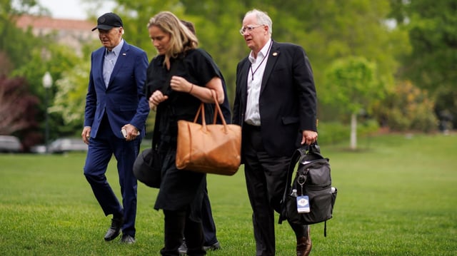 From left: President Biden, Annie Tomasini and Michael C. Donilon on the South Lawn of the White House on April 17, 2024. Photo: Ting Shen/Bloomberg via Getty Images