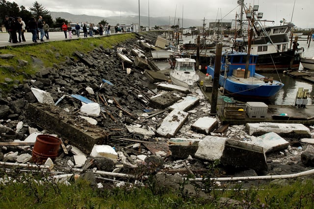 Dozens of onlookers March 12, 2011, came to see the damage at the Crescent City Harbor, which sustained the most damage of any harbor along the California coast after an earthquake in Japan the previous day triggered a tsunami.