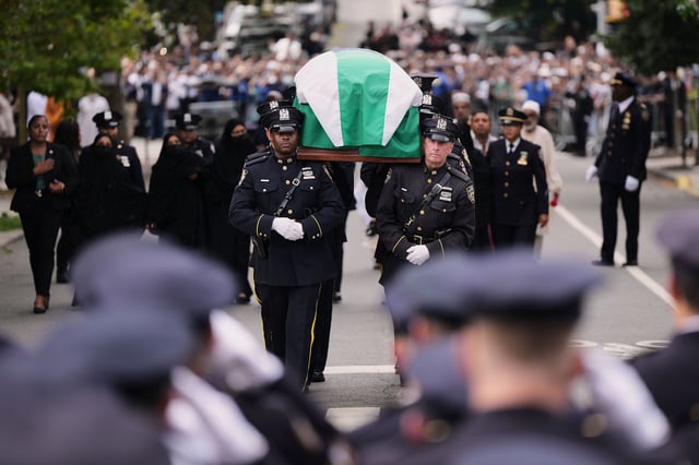 Pallbearers with the NYPD Ceremonial Unit carry the casket of officer Didarul Islam during his funeral, Thursday, July 31, 2025, in New York. (AP Photo/Angelina Katsanis)