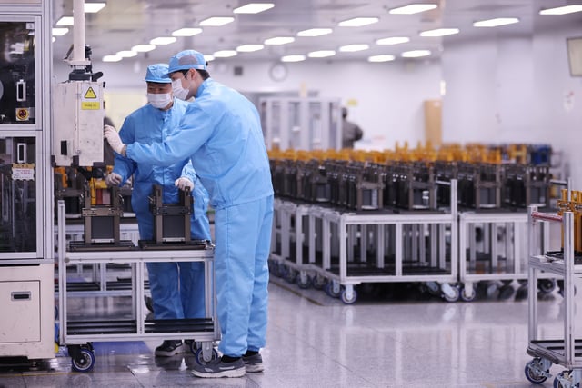 Employees work at SK On EV battery factory in Seosan, South Korea, October 19, 2023. REUTERS/Kim Hong-Ji/File Photo