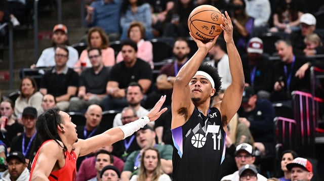 Apr 9, 2025; Salt Lake City, Utah, USA; Utah Jazz guard Jaden Springer (11) shoots over Portland Trail Blazers guard Dalano Banton (5) in the first half at Delta Center. Mandatory Credit: Jamie Sabau-Imagn Images