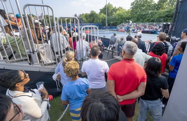 Overflow crowds gather at the entrances to watch doubles action between Gabriel Diallo and Alexis Galarneau of Canada against Alex Michelson and Frances Tiafoe of the United States at the National Bank Open in Toronto on Thursday, July 31, 2025. THE CANADIAN PRESS/Frank Gunn