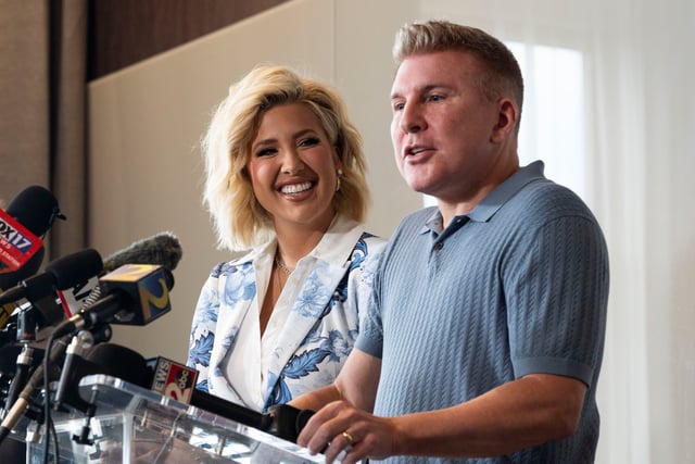 Todd Chrisley answers questions during a May 30, 2025, press conference at Nashville's Kimpton Aertson Hotel with daughter Savannah Chrisley (left) a day after he was released from prison following a full pardon from President Donald Trump.