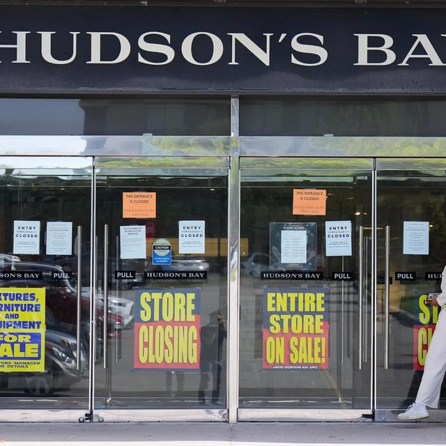 A person checks out the store closing advertising at the Hudson's Bay in Toronto, on Friday, May 30, 2025. THE CANADIAN PRESS/Nathan Denette