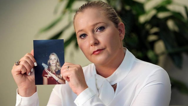 Virginia Giuffre, with a photo of herself as a teen, when she says she was abused by Jeffrey Epstein, Ghislaine Maxwell and Prince Andrew, among others. (Emily Michot/Miami Herald/Tribune News Service via Getty Images)