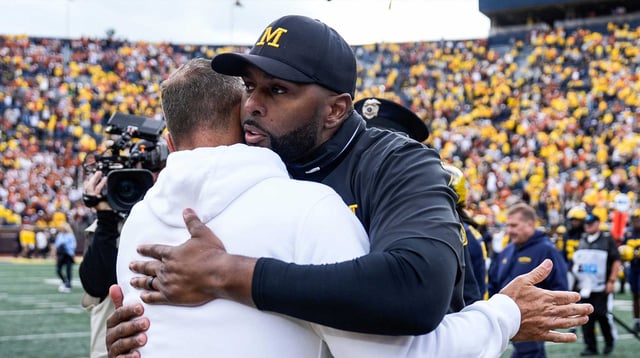 Sep 7, 2024; Ann Arbor, Michigan, USA; Michigan head coach Sherrone Moore hugs Texas head coach Steve Sarkisian after the game at Michigan Stadium. Mandatory Credit: Junfu Han-USA TODAY Network via Imagn Images