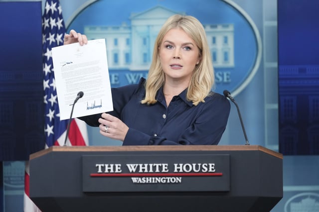 White House press secretary Karoline Leavitt holds up a letter from President Donald Trump to Eli Lilly CEO David Ricks during a press briefing at the White House in Washington, Thursday, July 31, 2025. (AP Photo/Mark Schiefelbein)