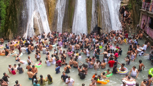 Mussoorie: Tourists bathe at Kempty Falls