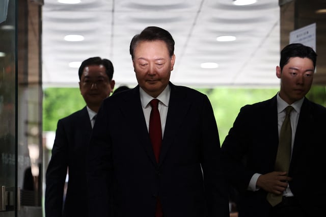 Former South Korean President Yoon Suk Yeol arrives at a court to attend a hearing to review his arrest warrant requested by special prosecutors in Seoul, South Korea, July 9, 2025. REUTERS/Kim Hong-Ji/Pool/File Photo