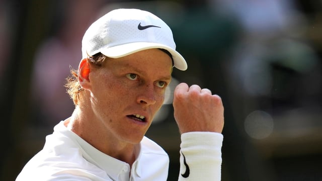 Italy's Jannik Sinner reacts after winning a point against Carlos Alcaraz of Spain in the men's singles final at the Wimbledon