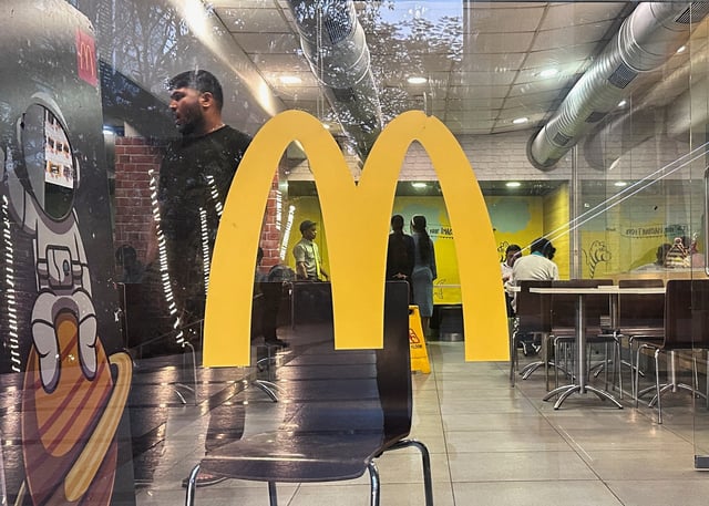People dine inside a McDonald's restaurant in Mumbai, India, February 26, 2024. REUTERS/Francis Mascarenhas/File Photo